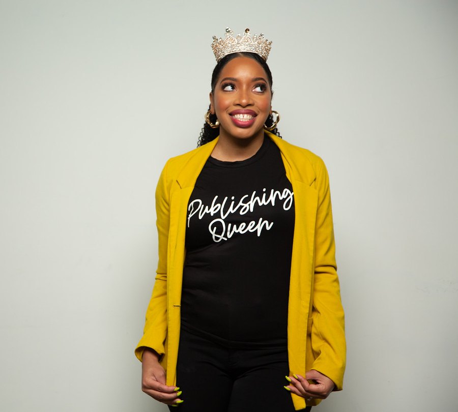 Crystal Swain-Bates wearing a crown and a Publishing Queen shirt