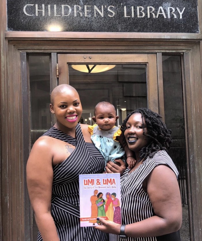 Umi and Uma authors with the book at a children's library